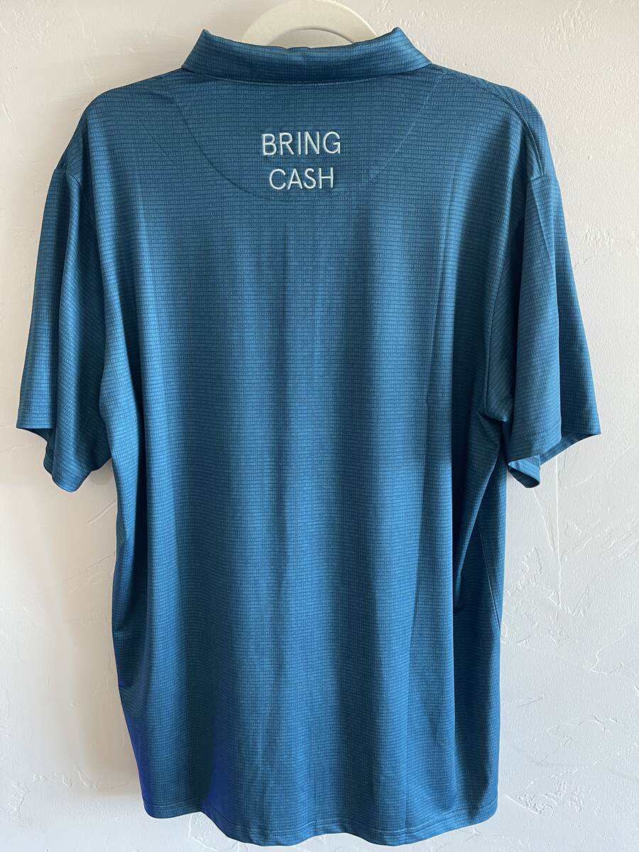 Teal Duck Hook Golf performance polo, back with BRING CASH embroidery